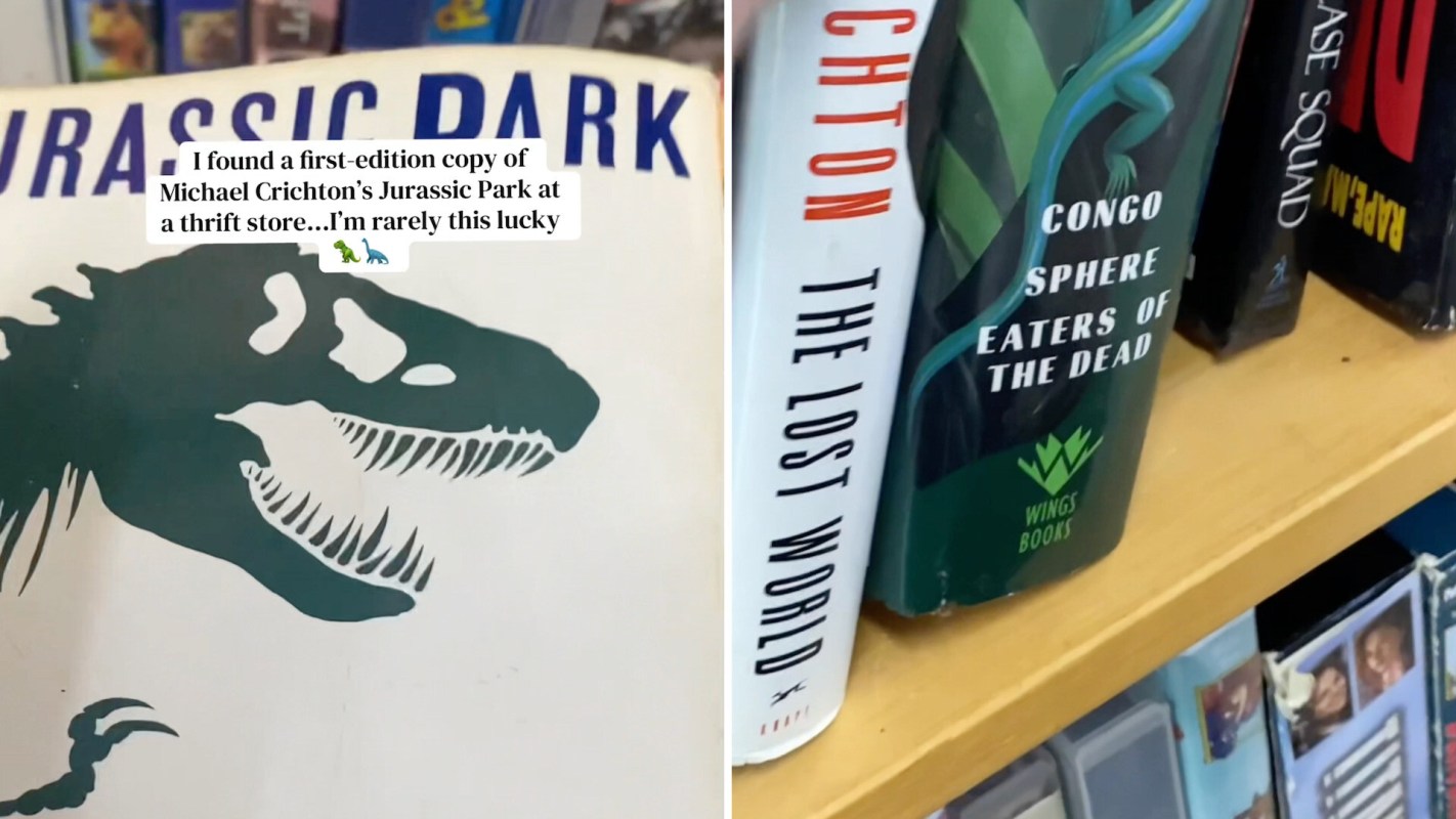 A first-edition "Jurassic Park" book and other books in a thrift store.