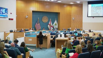 Residents pack a council meeting in Florida.
