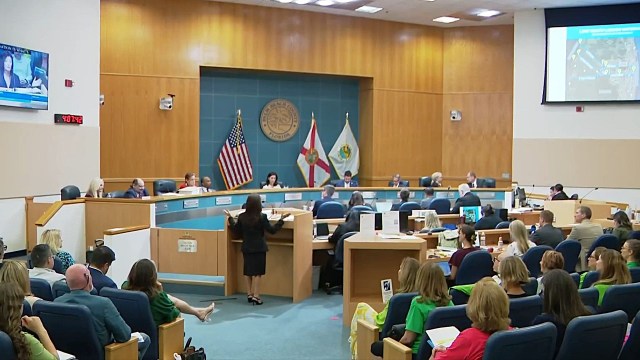 Residents pack a council meeting in Florida.