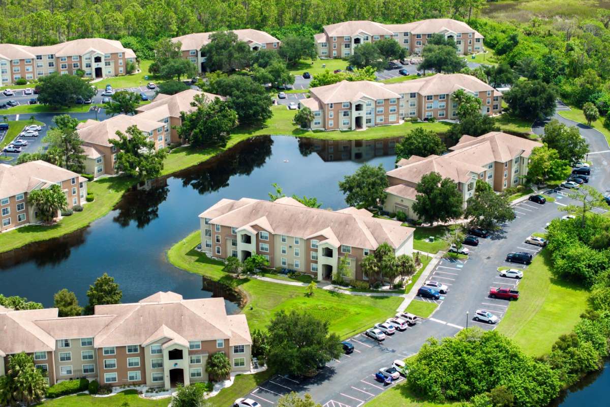 Florida condo buildings surrounding a lake.