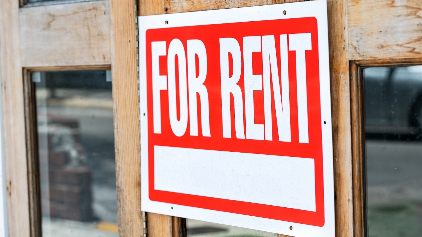 A "For Rent" sign.