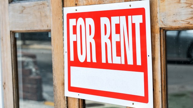 A "For Rent" sign.