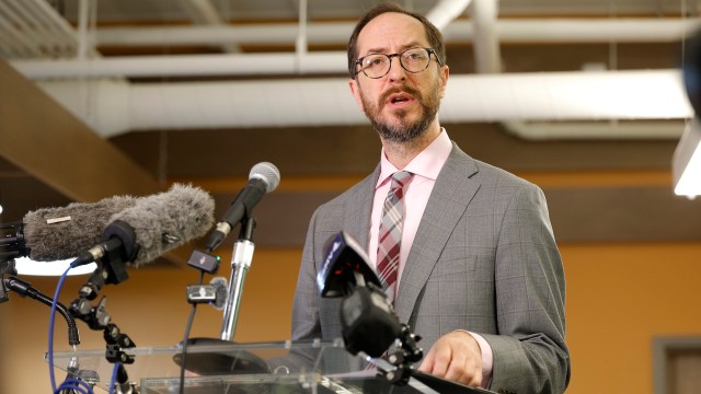 Nashville mayor Freddie O'Connell speaks at a podium with microphones during a press conference.