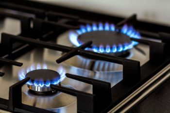 Two active burners on a gas stove.