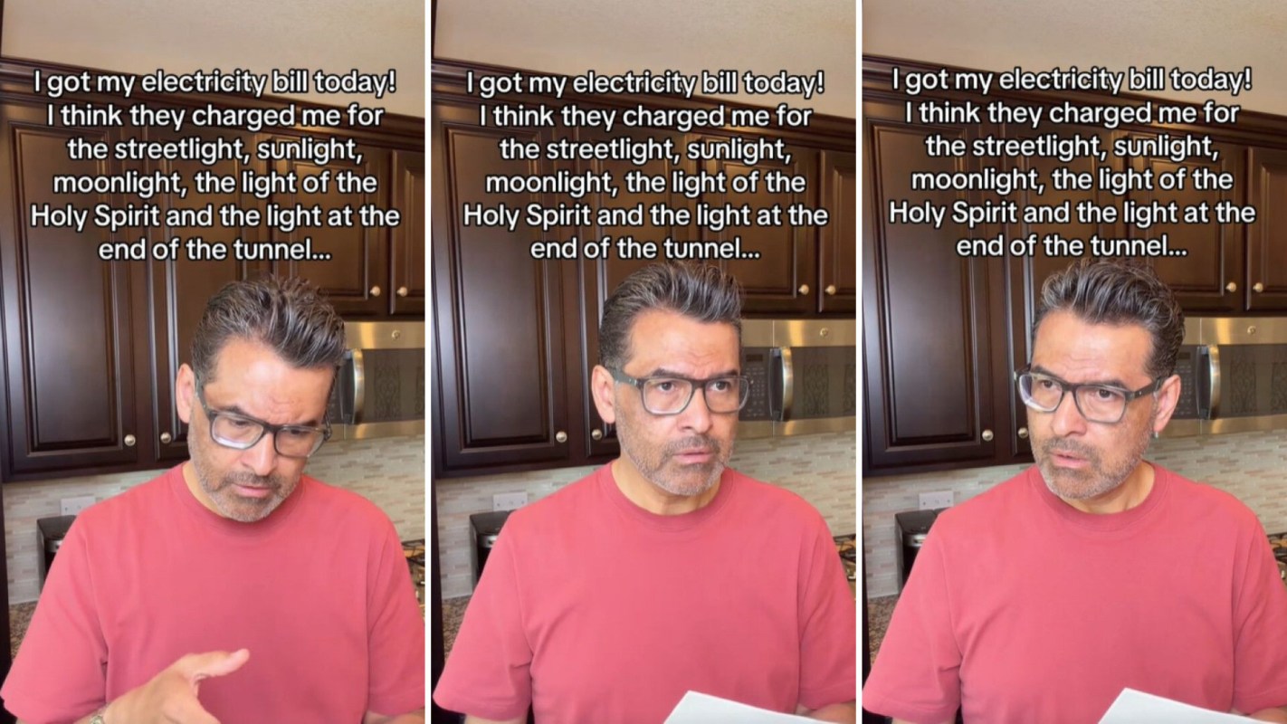 A man looking at his electric bill.