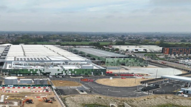 An aerial view of a large industrial complex with buildings and construction areas.