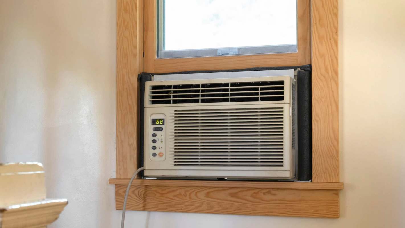 A window air conditioning unit set to 68 degrees Fahrenheit.