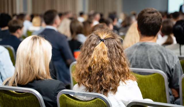 A group of people in a meeting.