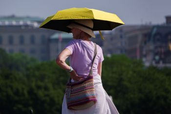 A woman holding an umbrella.