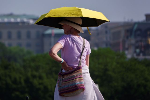 A woman holding an umbrella.