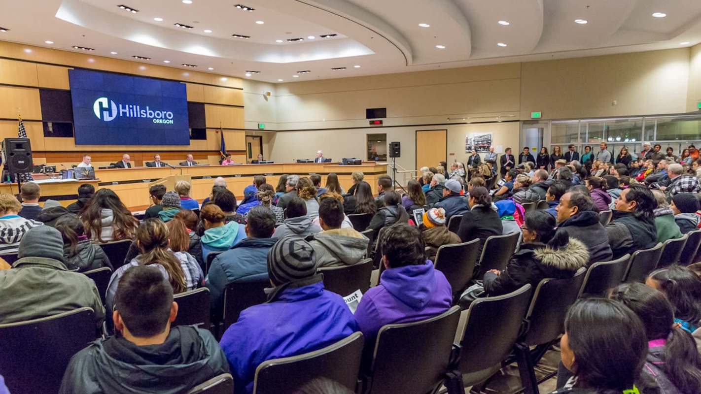 A packed city council meeting.