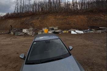 Trash dumped on land.