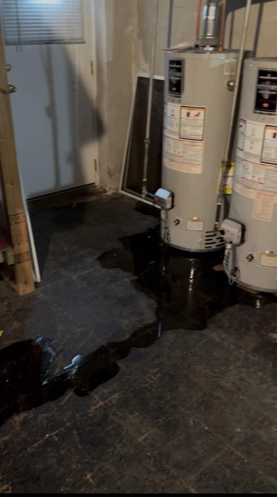 Water leaking from a water heater.