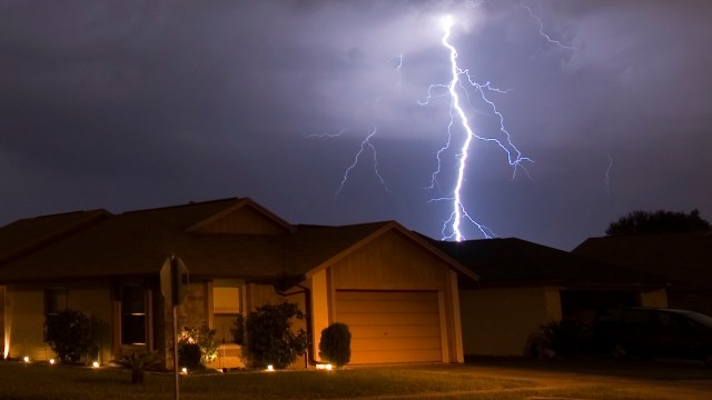A lightning strike near a residential neighborhood.