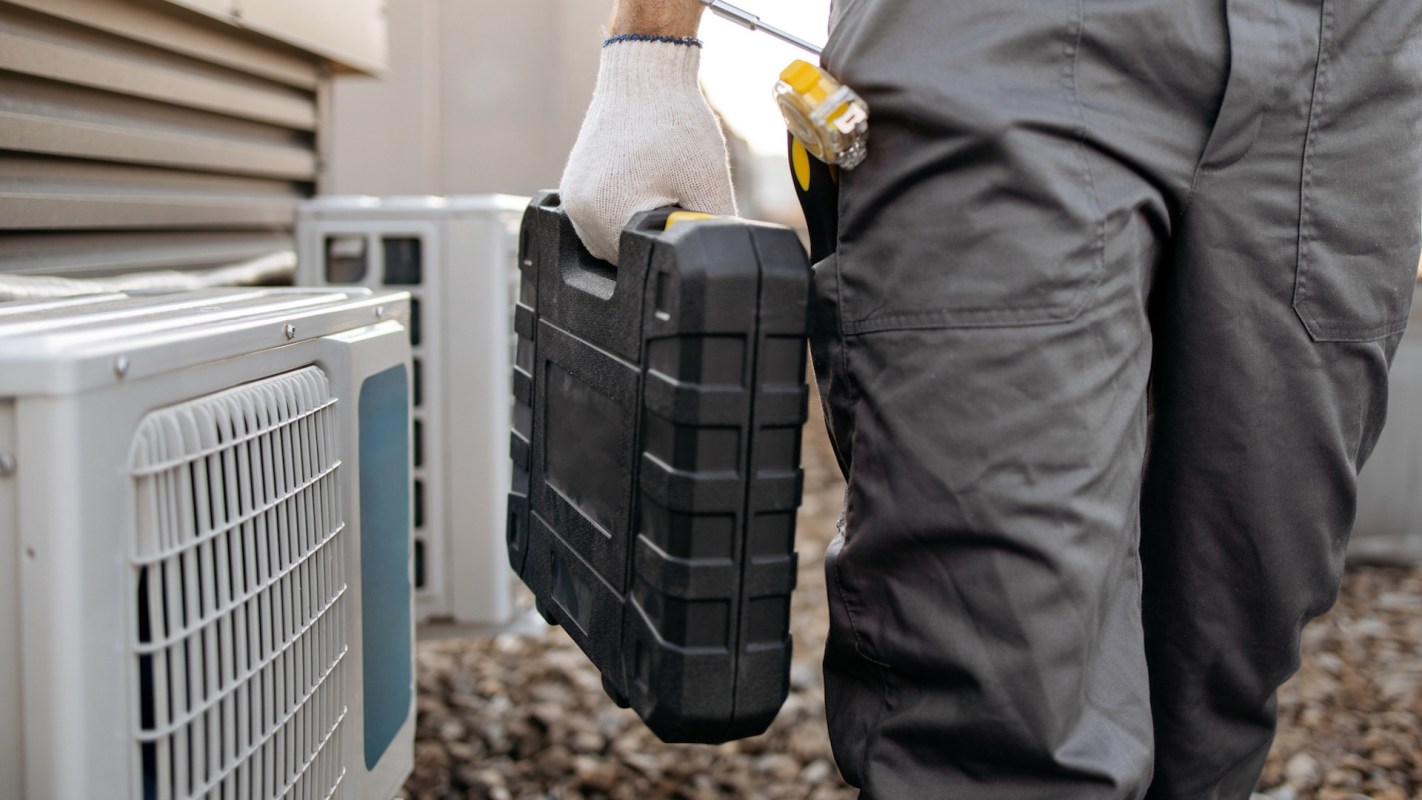 An HVAC technician with a toolkit.