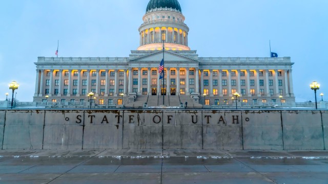 The Utah State Capitol building illuminated at dusk.