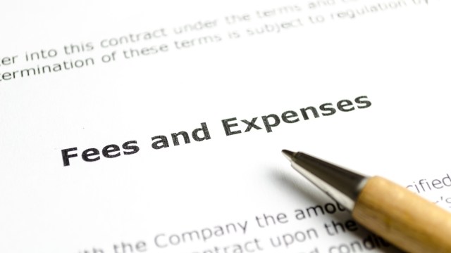 A close-up of a document showing the heading "Fees and Expenses" next to a pen.