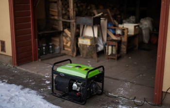 A portable generator outside a storage area.