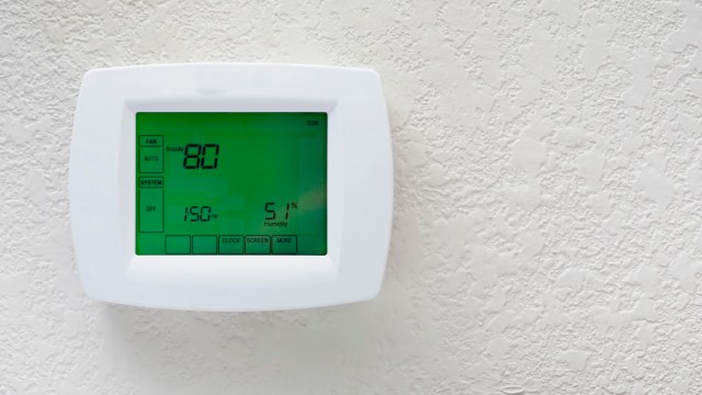 A digital thermostat displaying a temperature of 80°F and humidity level of 51%.