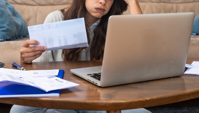 A woman reviewing documents.