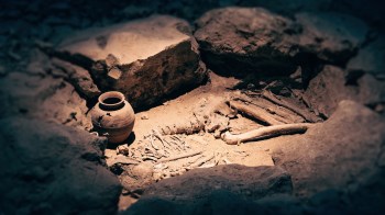 An archeological site with human remains.