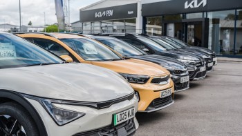 Cars at a Kia dealership.