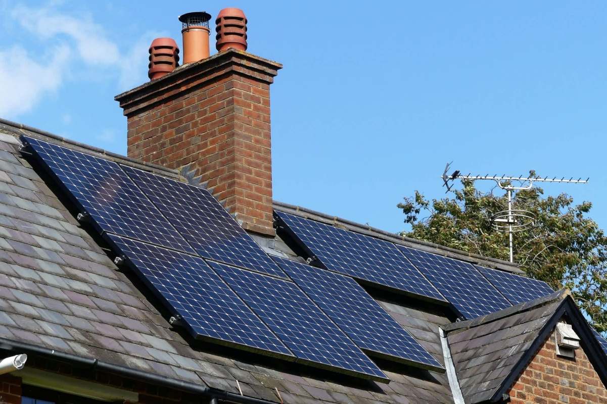 A house with rooftop solar panels.