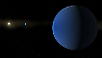 A blue planet orbits a star in a dark space filled with distant stars.