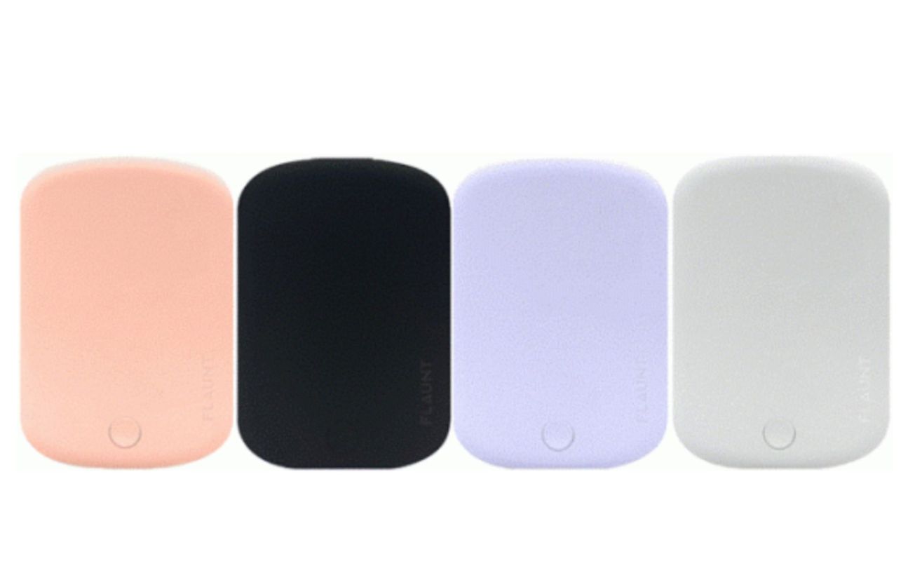 Four portable power banks in pastel pink, black, light purple, and white, lined up side by side.