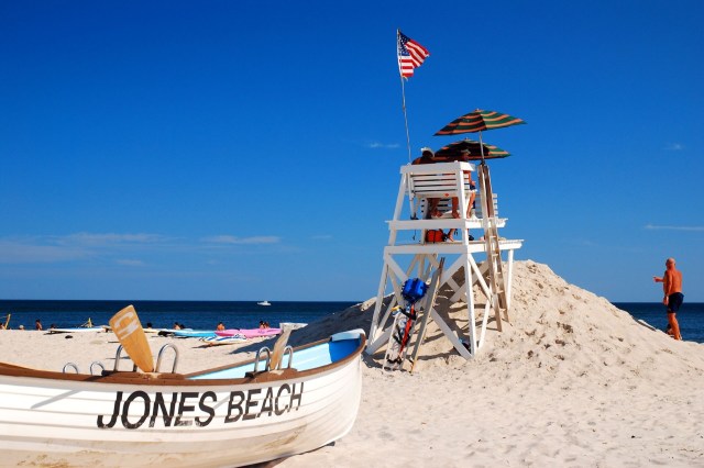 A boat and lifeguard stand on Jones Beach in New York.