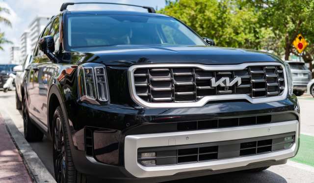 A black Kia SUV.