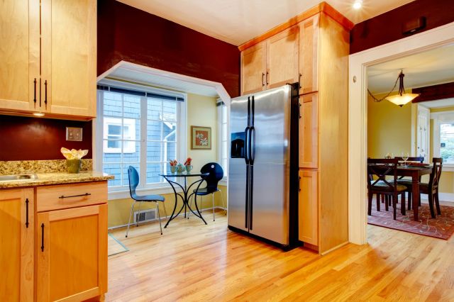 A kitchen with a dining area.