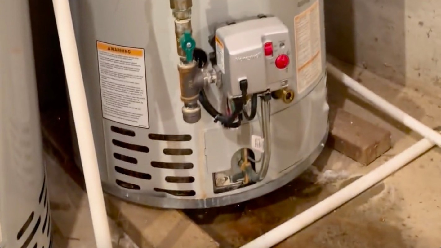 A puddle near a gas water heater.