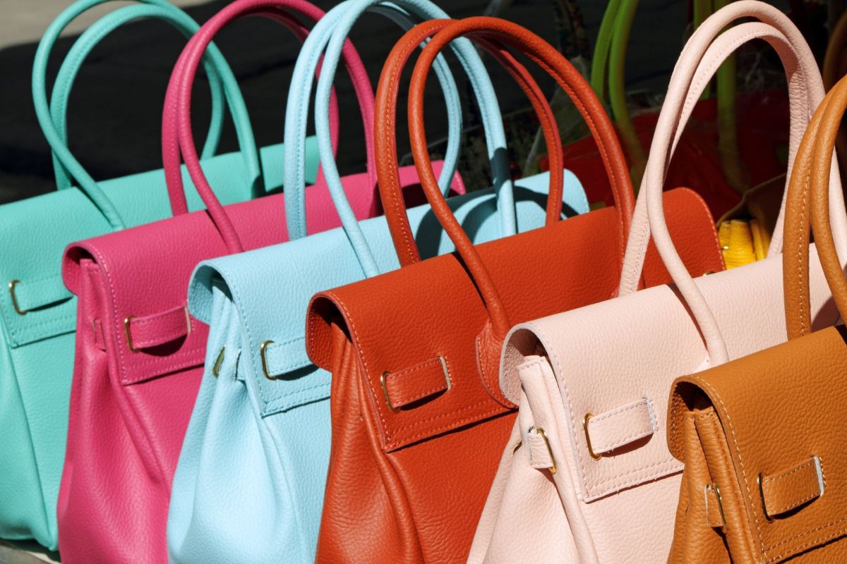 A row of leather handbags.