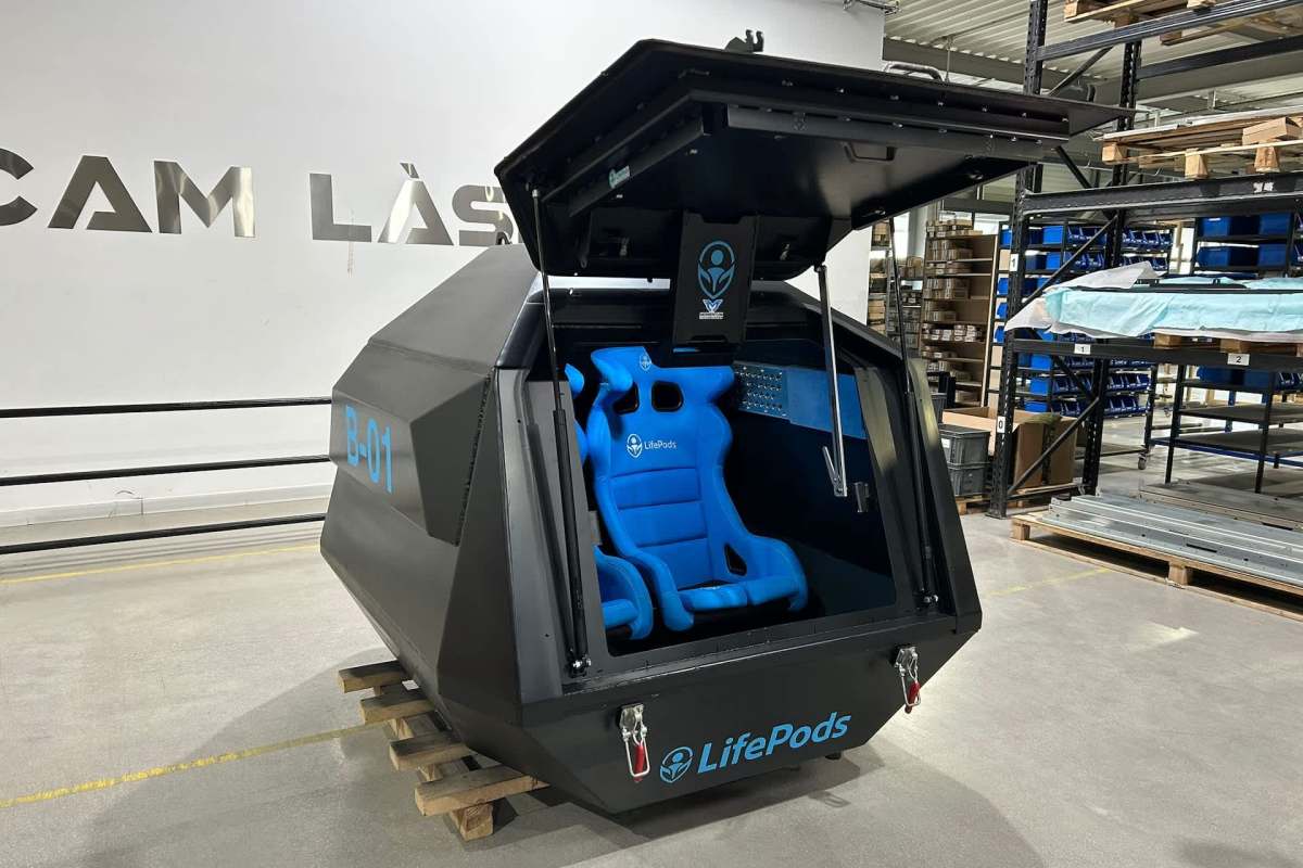 A black and blue Lifepod with an open top.