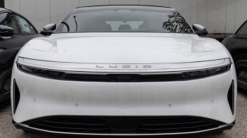 The front of a white Lucid electric vehicle.