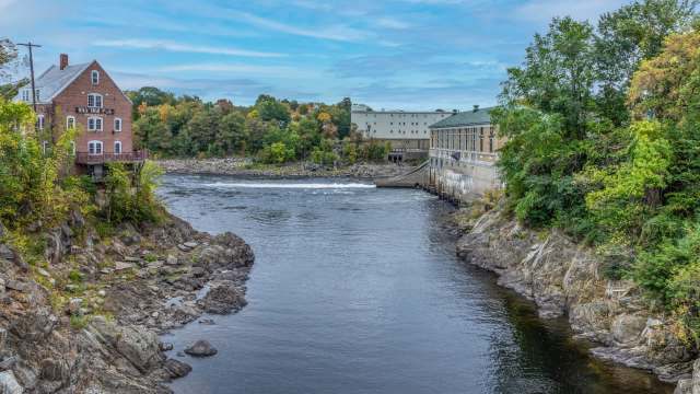Historic brick buildings overlooking the Kennebec River.
