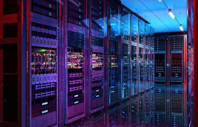 A brightly lit server room with colorful cables and racks of servers in a futuristic design.