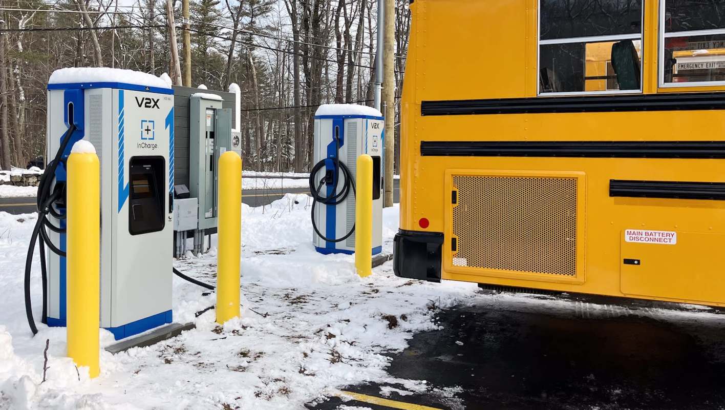 A bus near an EV charging station.