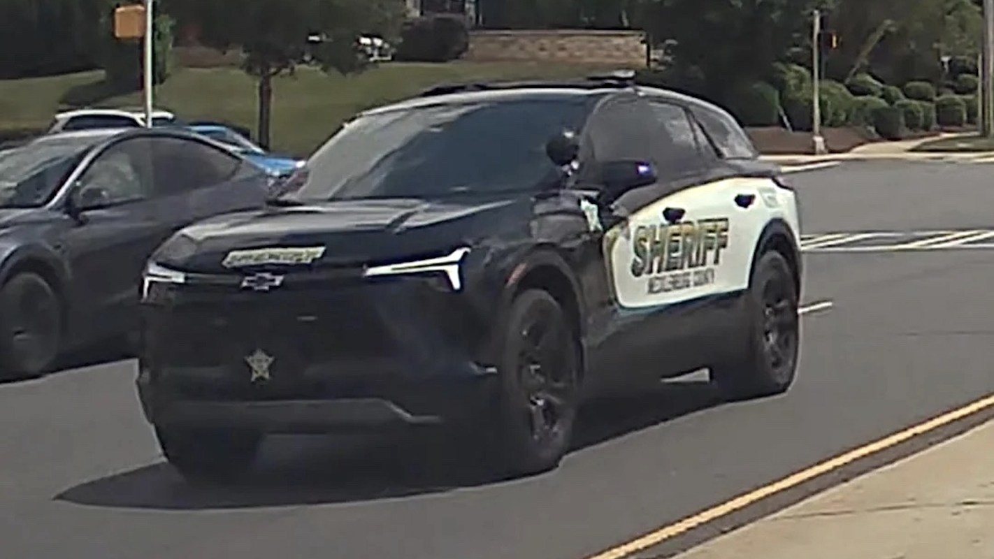 A black and white sheriff's vehicle is parked on a street.