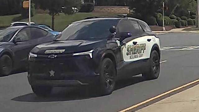 A black and white sheriff's vehicle is parked on a street.