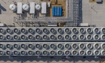 An aerial view of an industrial facility with rows of cooling fans.