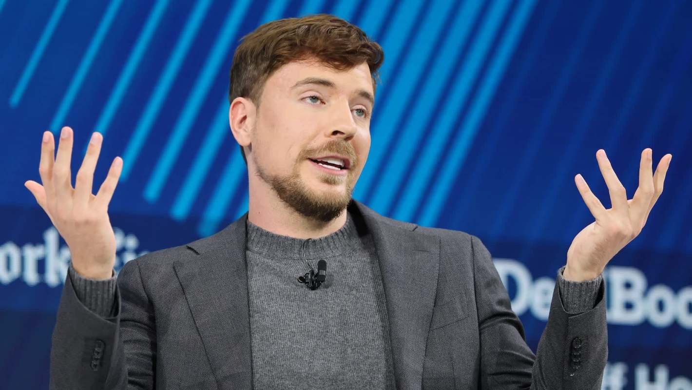 MrBeast gesturing while speaking on stage.