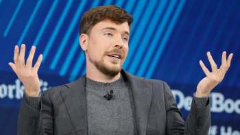MrBeast gesturing while speaking on stage.