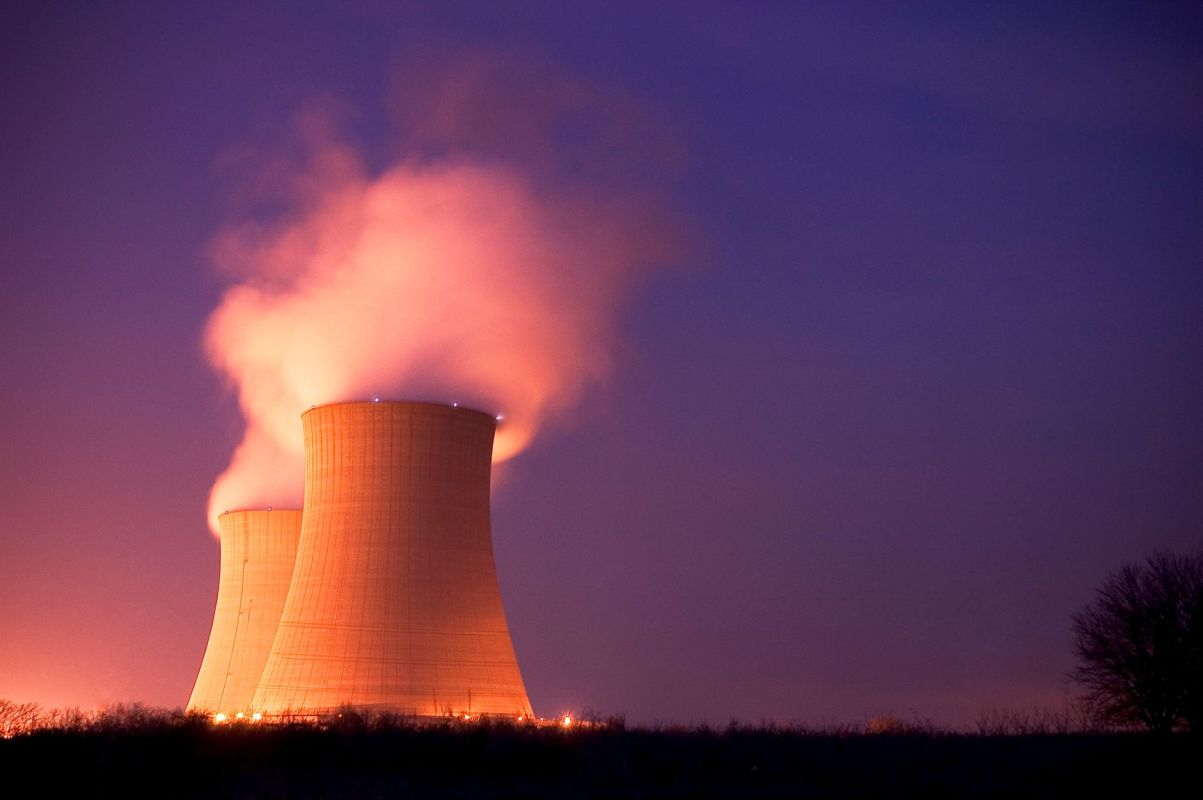 An nuclear power plant releases water vapor.