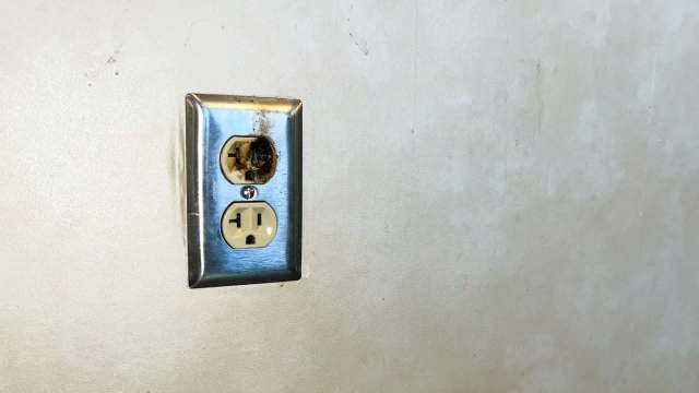 A burnt electrical outlet.