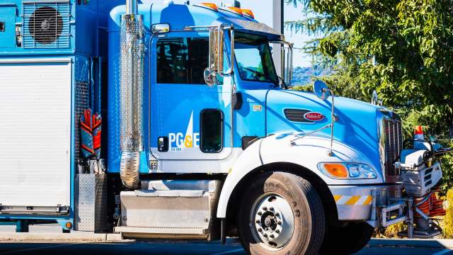 A blue PG&E service truck.