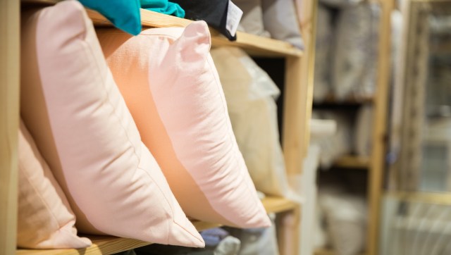 Pillows on a shelf at a home decor store.