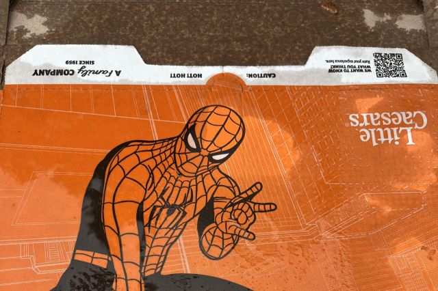A Little Ceasers Spiderman-themed pizza box.