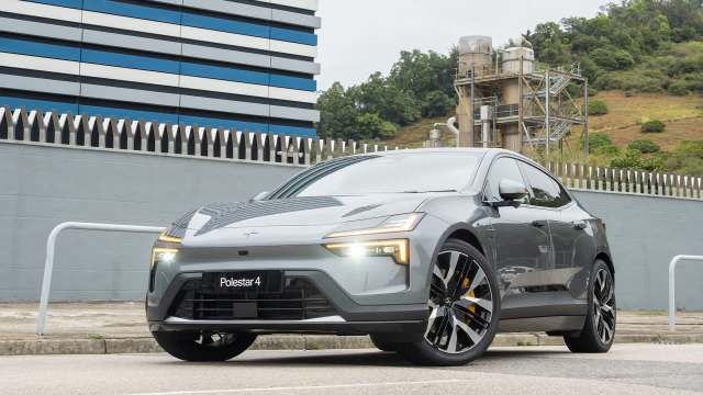 A gray Polestar 4 electric car parked on a street.